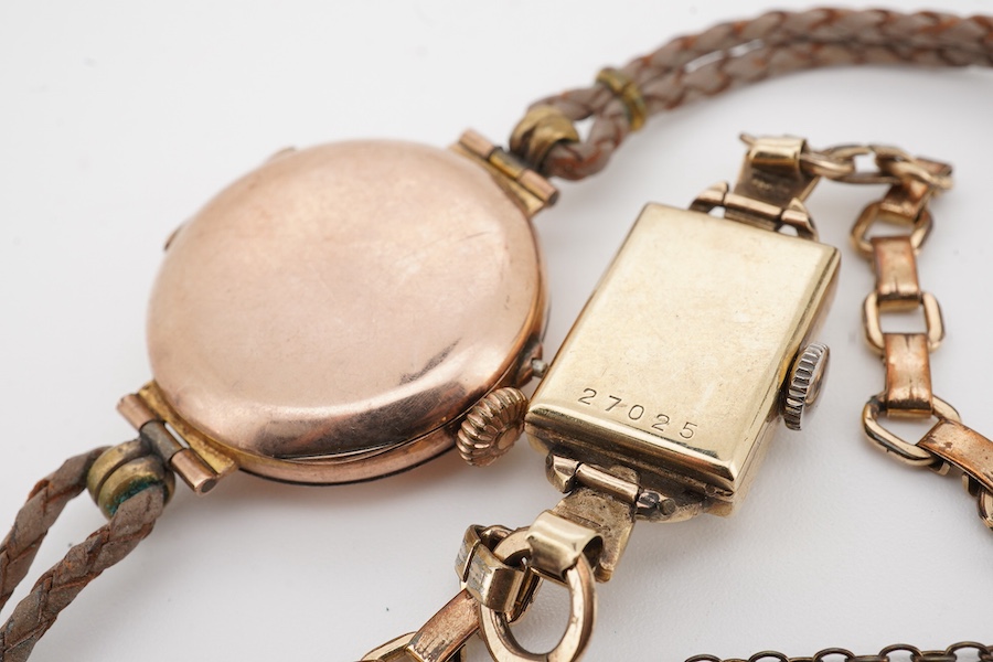 Two lady's 9ct gold manual wind wrist watches, on on fabric strap, the other on gold plated strap.